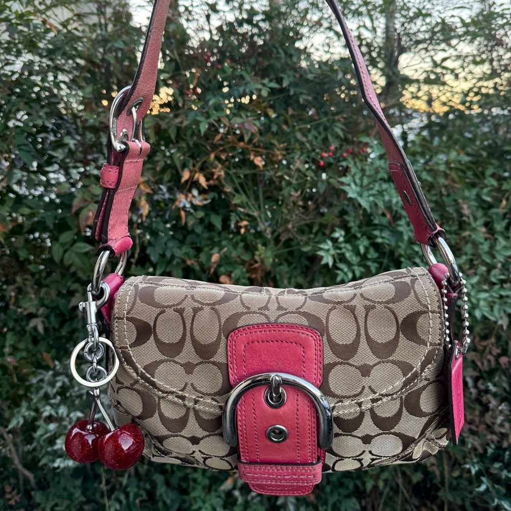 Pink coach soho bag with signature canvas and leather trim
